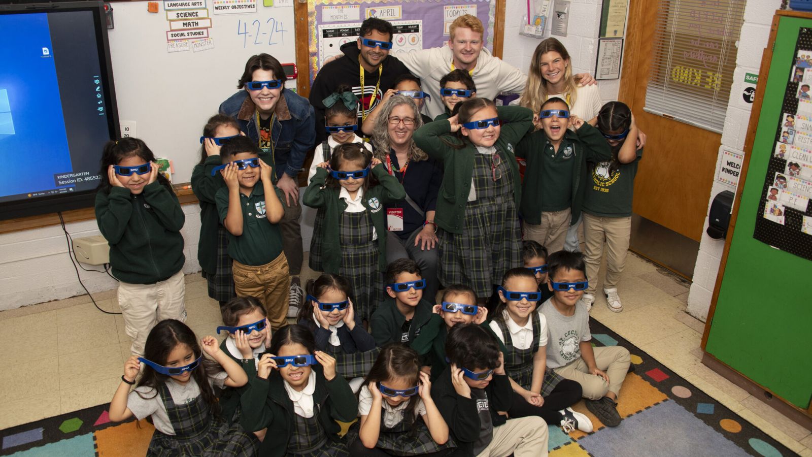 Southern Methodist University students, their Spanish professor, Talia Weltman-Cisneros, and St. Cecilia Catholic School kindergartners are prepared to understand and safely experience the April 8 solar eclipse. (Photos by Hillsman S. Jackson, SMU)